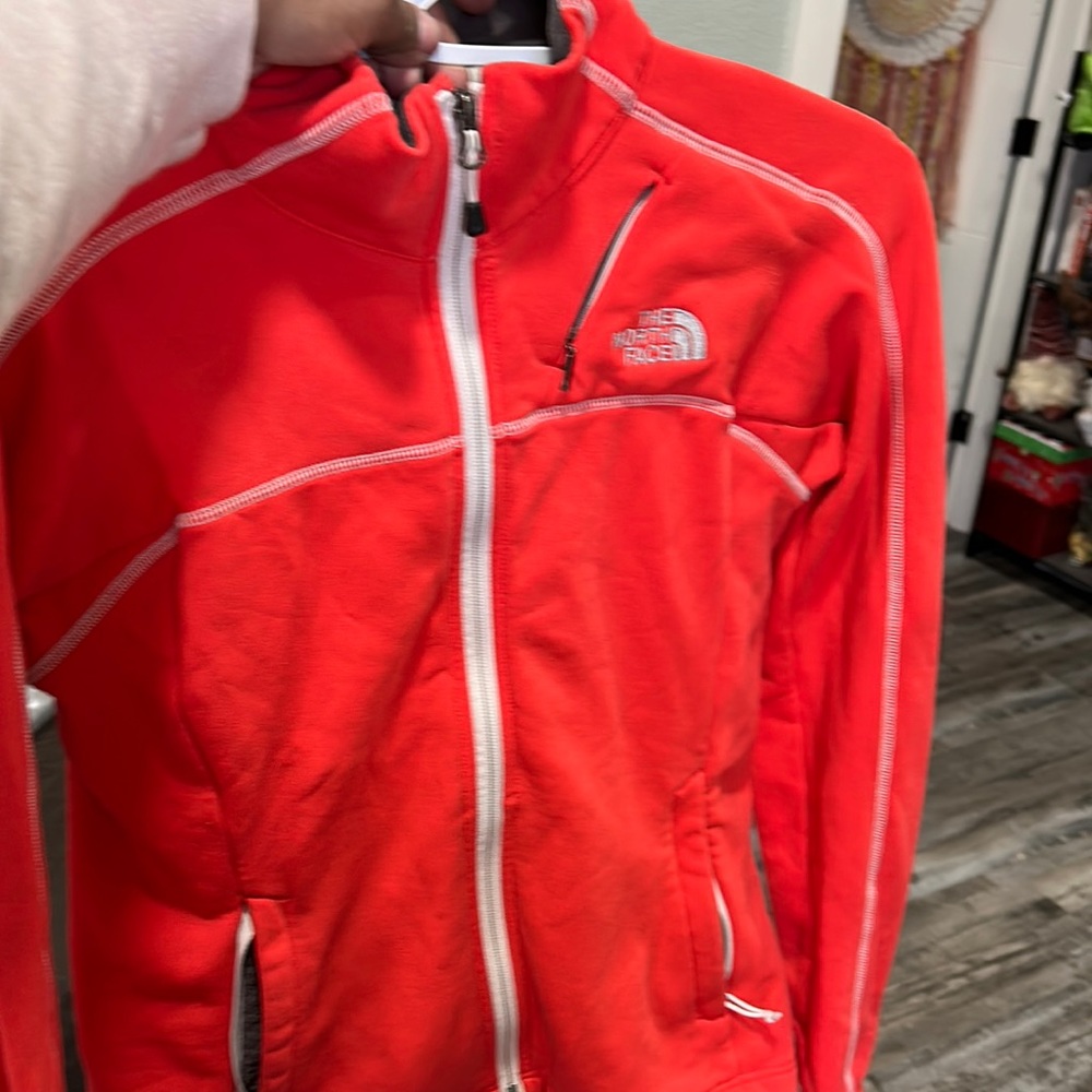 Orange north face jacket